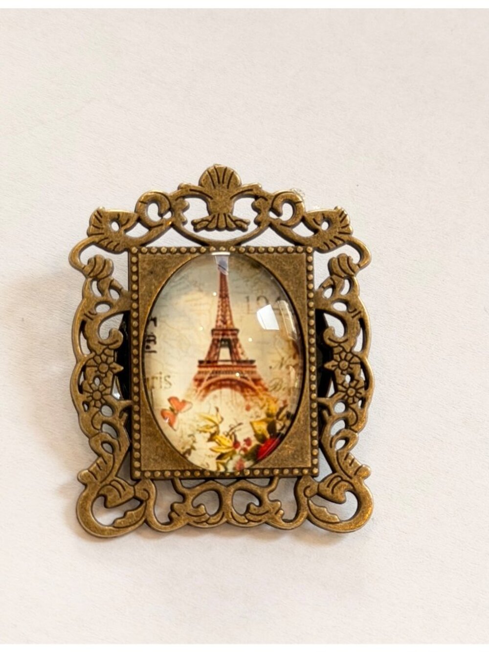Vintage-Style Eiffel Tower Brooch With Ornate Bronze Frame And Glass Dome